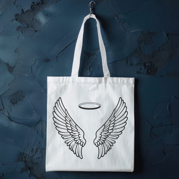 Beautiful Angel Wings Design SVG angel wing design with intricate details and a halo effect, suitable for vector art and digital cutting.