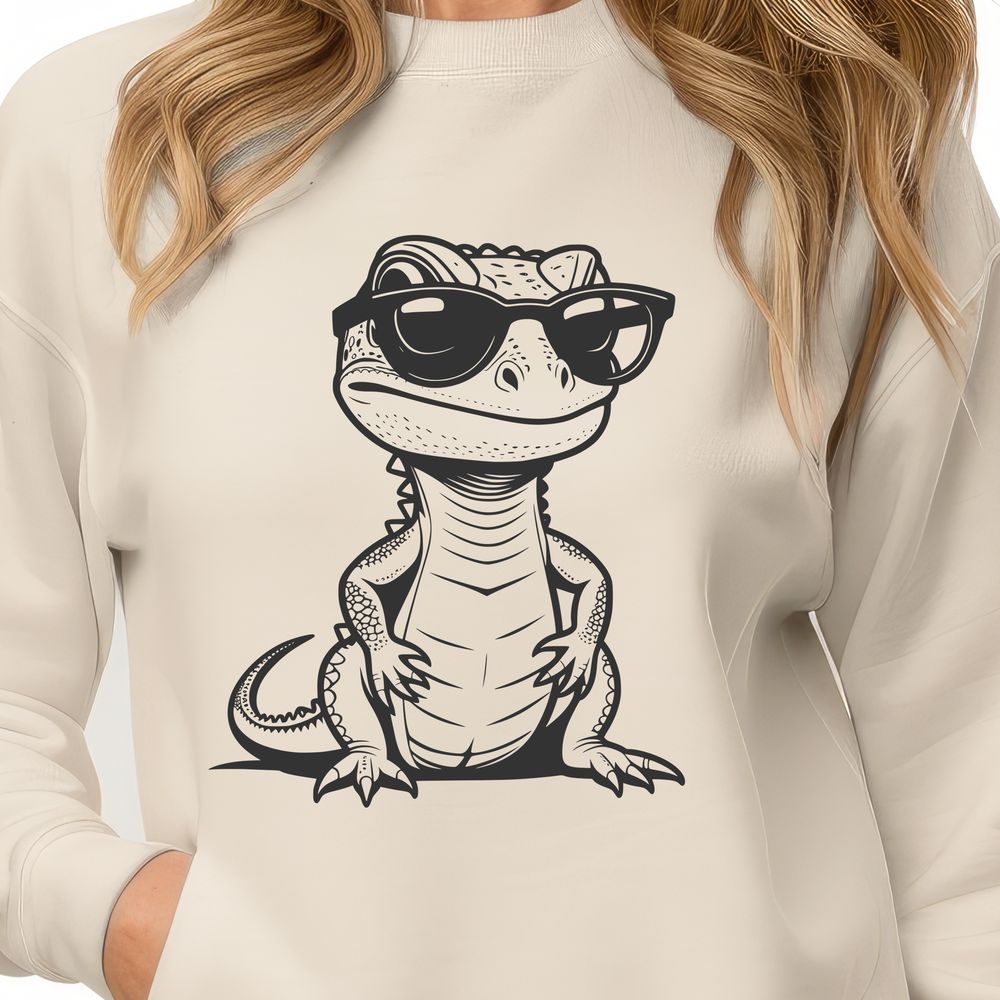 Fun Lizard Silhouette in Sunglasses A cartoon lizard wearing trendy sunglasses sits on a rock in the desert.