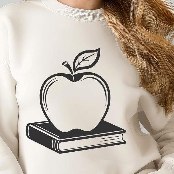 Teacher's Desk Decor with Open Apple Book Vector illustration of a teacher's desk with an open Apple Book, ideal for educational settings and classroom decorations.
