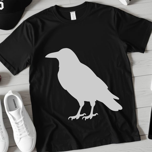 A black bird with glossy feathers perched on a branch.