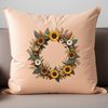A simple floral wreath made with sunflowers and greenery.