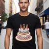 A colorful birthday cake with candles lit on top, ready to be served at a celebration.