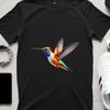 Colorful Bird Silhouette PNG A vibrant hummingbird in flight, with a clear background.
