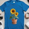 Bright Yellow Sunflower in Vase A large, bright yellow sunflower with dark center and green stem, growing in a simple flower pot on a clear background.
