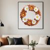 A floral wreath made up of colorful flowers and foliage, suitable for download and commercial or personal use.