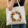 A handcrafted floral wreath featuring a large sunflower as its central element.