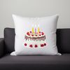 A colorful birthday cake with multi-tiered layers, topped with candles and decorations.