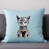 Adorable Gray Kitten on a Clear Background A small domestic cat with gray fur and bright eyes sitting on a clear background.