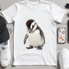 Cute Cartoon Penguin on White Background A cute, cartoon-style baby penguin standing on its feet, with a clear background.