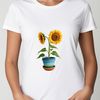 Beautiful Sunflower in Pot A bright yellow sunflower with large petals and a dark center grows in a small flower pot on a clear background.