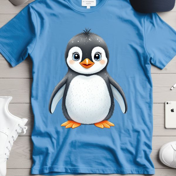 A baby penguin standing on a rock, against a clear blue background.