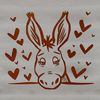 A cartoon donkey peeking out from behind something with hearts surrounding its head.
