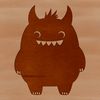 A small, cartoon monster with a smiling face, suitable for Halloween decorations or crafts.
