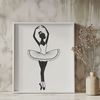 Elegant Dancer Silhouette A young ballerina in a flowing tutu standing en pointe on one foot.