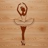 Ballet Dancer Silhouette A young ballet dancer in a tutu and ballet shoes performing on stage.