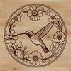 Free SVG Vector Design - Hummingbird Clipart A colorful hummingbird perched on a branch surrounded by flowers, perfect for vector design and clip art.