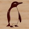 Snowy Seabird A penguin standing on rocky coastline in a snowy landscape.