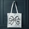 Festive Gift Wrap Embellishment A decorative bow used as a gift wrap accent or embellishment for Christmas presents.