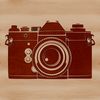 A high-resolution digital camera with lens and body.