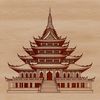 A traditional Buddhist temple with intricate architecture, set against a simple background.