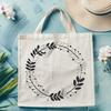 A floral design element in the form of a circular wreath with intricate details.