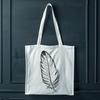 White Feather Silhouette A single white feather with soft, rounded edges, suitable for digital design projects.