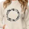 Circular Floral Design SVG A floral design consisting of intertwined flowers and foliage forming a circular shape.