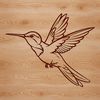 A vibrant illustration of a hummingbird in flight, showcasing its rapid wing movement.