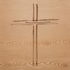 A traditional religious symbol featuring a cross with a figurative representation of Christ's crucifixion.