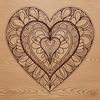A intricately designed mandala heart with symmetrical patterns and shapes, suitable for vector art projects.