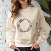 Intertwined Floral Circular Design A floral design featuring intertwined elements forming a circular shape.