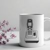 A vector illustration of a classic telephone with receiver and keypad.