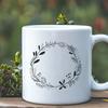 Free Vector Floral Decoration A hand-drawn floral wreath design suitable for vector art projects.