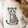 A sitting big cat with distinctive markings, resembling a wild animal native to the Americas.