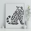 A sitting wild animal with distinctive markings, a big cat native to the Americas.