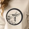 Colorful Bird with Floral Wreath SVG An illustrated hummingbird with iridescent feathers, surrounded by flowers.