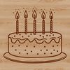 A decorative, layered cake with candles on top, suitable for a birthday celebration.