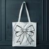 Decorative Ribbon Bow Vector Graphic A decorative bow made from ribbon or fabric, suitable for gift wrapping and various crafting projects.