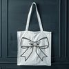 Colorful Bow Decoration A colorful ribbon bow with loops and swirls, suitable for crafting or decorating gifts.