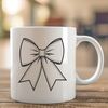 Elegant Ribbon Decoration A decorative bow made from ribbon and ribbon ends, suitable for craft projects and gift wrapping.