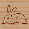 Relaxing Bunny Illustration A simple illustration of a rabbit in a relaxed pose, suitable for various design projects.