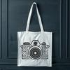 A detailed illustration of a camera with ornate details and precise lines, suitable for vector art designs.