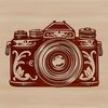 Elegant Camera Icon A digital camera with ornate details, ideal for vector art designs.