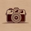 Free Camera Clip Art A digital camera with a prominent lens and body, ideal for graphic design projects requiring vector art.