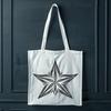 A stylized star symbol made from clean lines and simple shapes, ideal for digital designs and crafts.