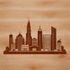 A detailed illustration of a city skyline at sunset.