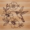 A colorful illustration of a hummingbird in flight surrounded by flowers, suitable for crafting and design projects.