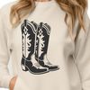 A pair of classic cowboy boots with intricate stitching and lacing details.