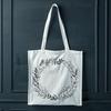 Elegant Interlacing Leaf Pattern A detailed floral design made up of intertwining stems and leaves, forming a circular shape.