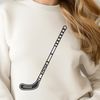 Simple Vector Hockey Design Illustration of a hockey stick and puck on a white background.